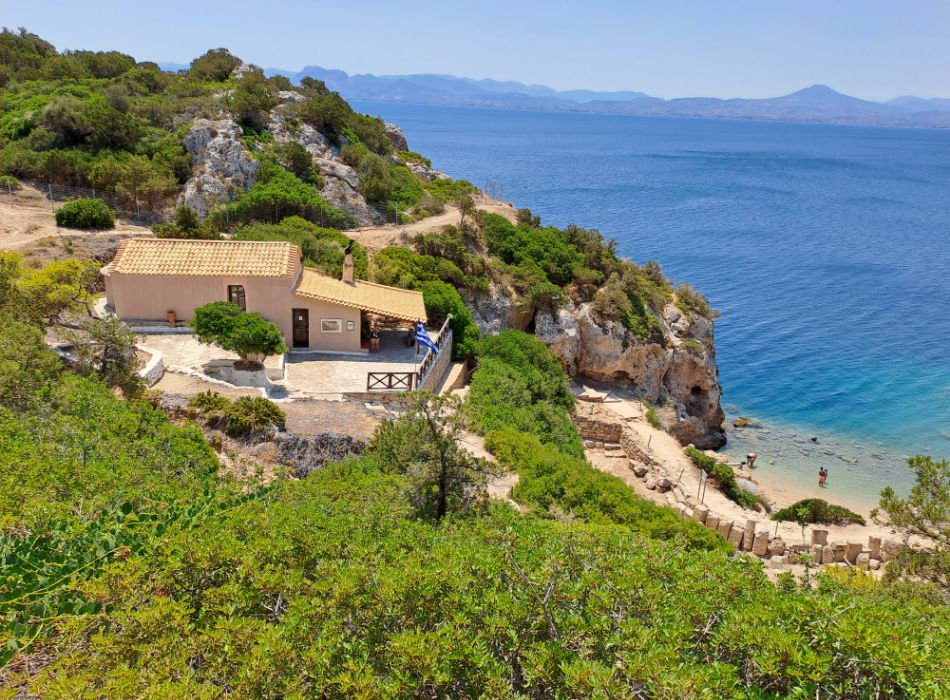 The small Church at Iraion archaeological site and the seaside.