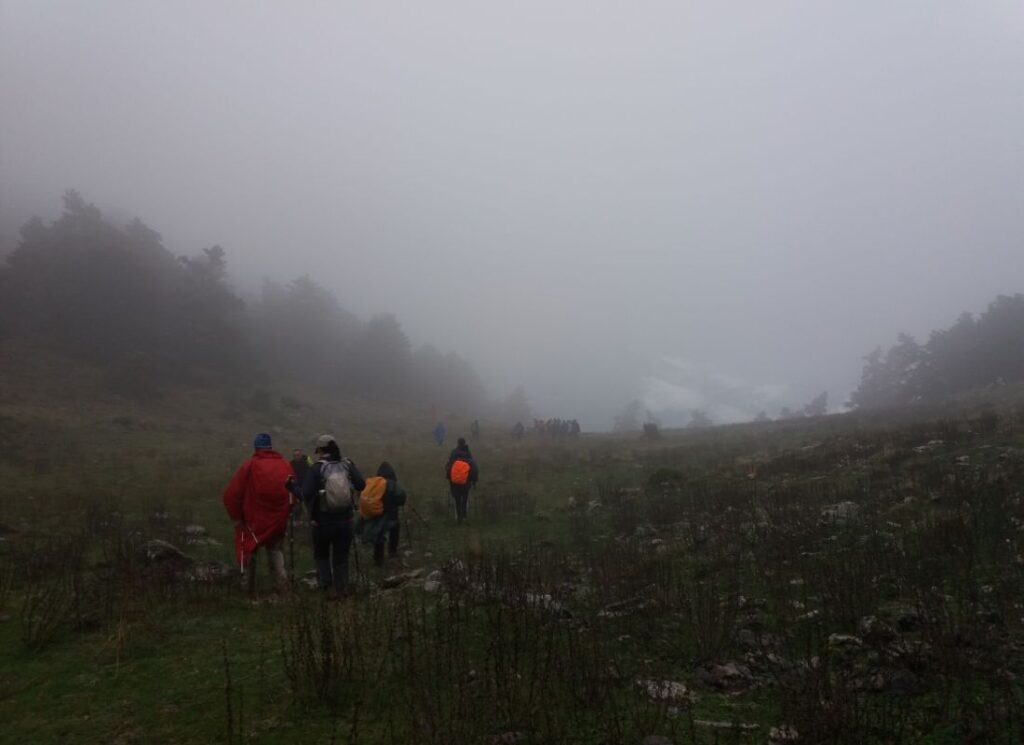 parnassos mountain in Greece hikers walking in fog