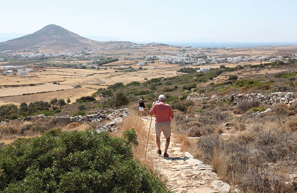 Scenic hiking trail in Paros, Greece, with panoramic views of the island's landscape.