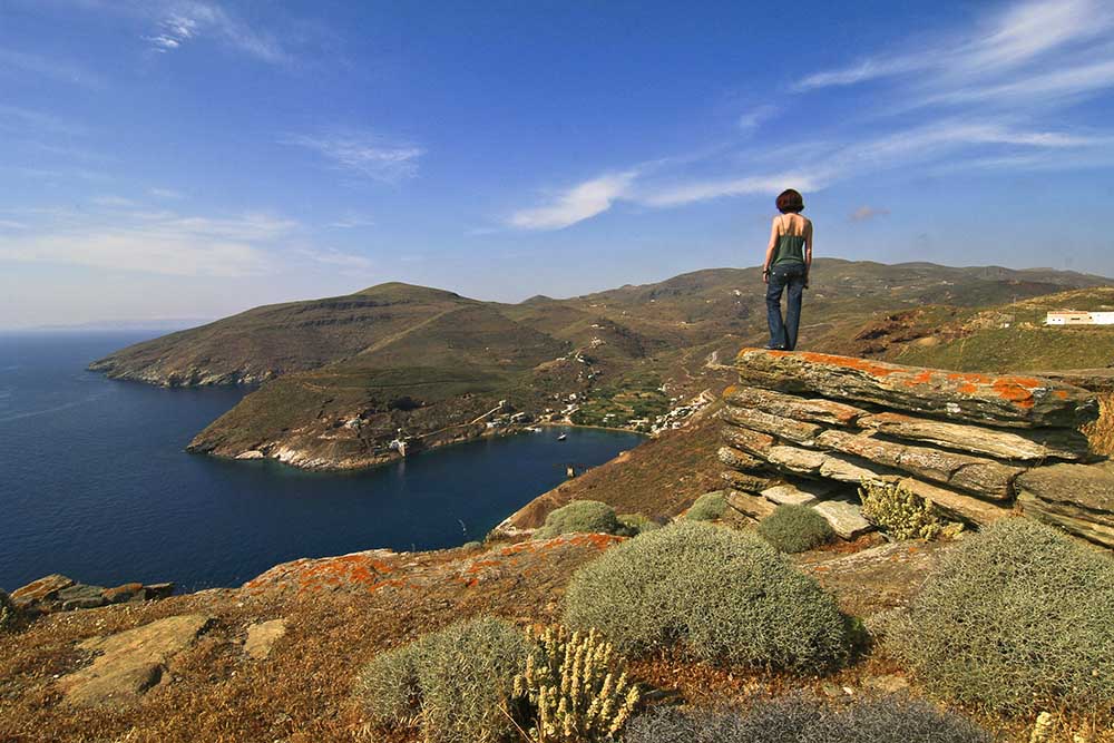Hiking Cyclades Islands, hiker on Serifos Trail.  Hiking Cyclades islands.