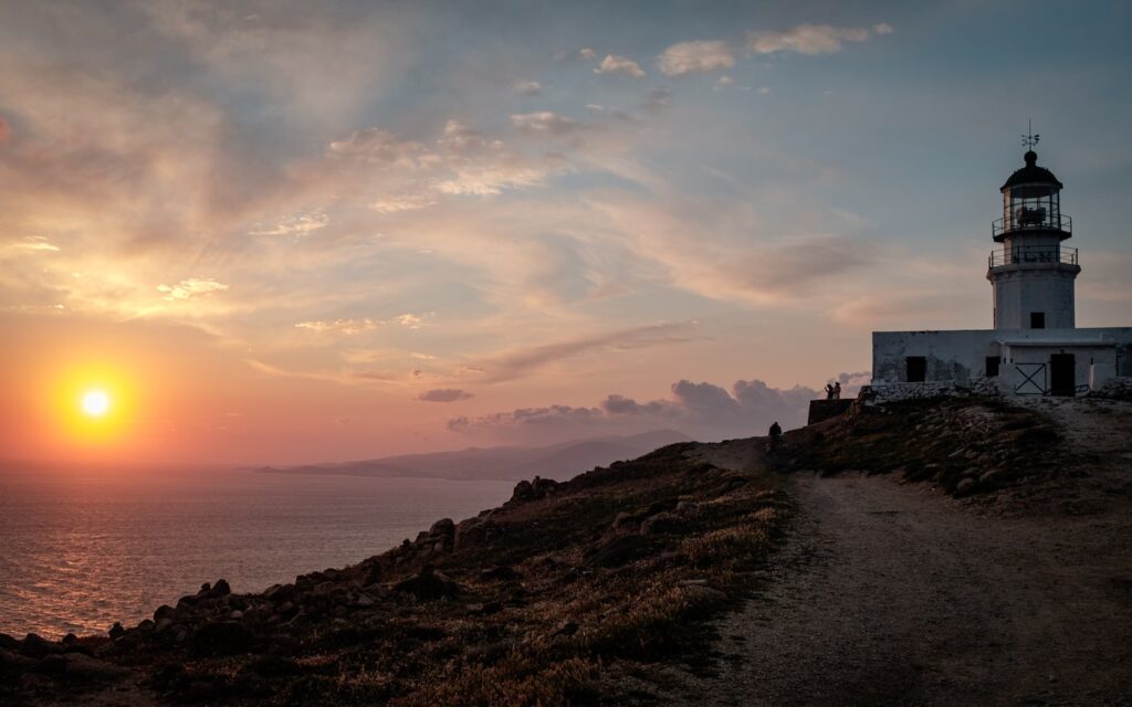 Armenistis Lighthouse on the sunset in Mykonos island.