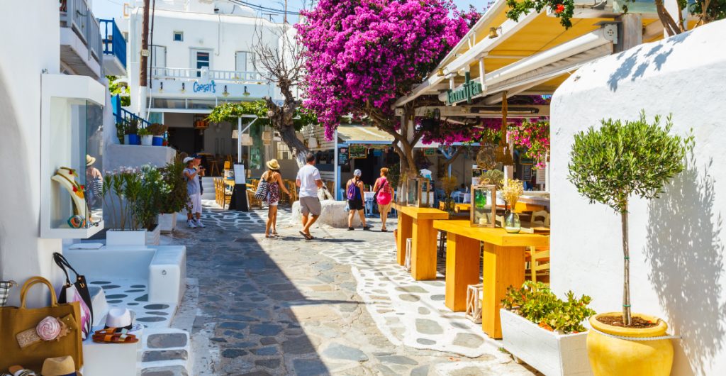 Mykonos island Matogianni street with tourists in in Chora Mykonos.