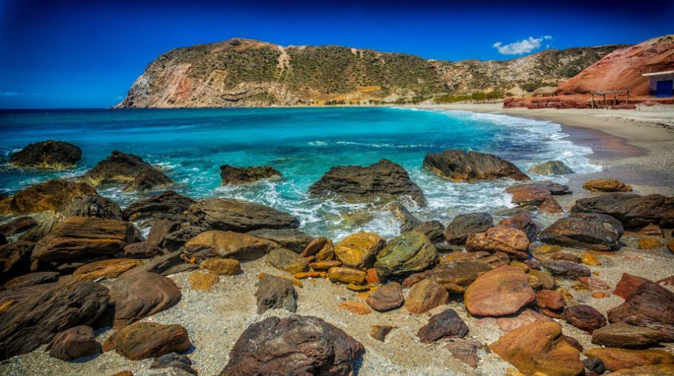 Agia Kyriaki beach with Sand and Rocks in Milos Greece.