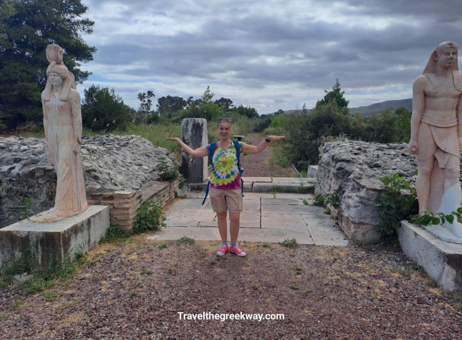 Evgenia posing between two replica Egyptian statues at the Sanctuary of Egyptian Gods, Marathon.