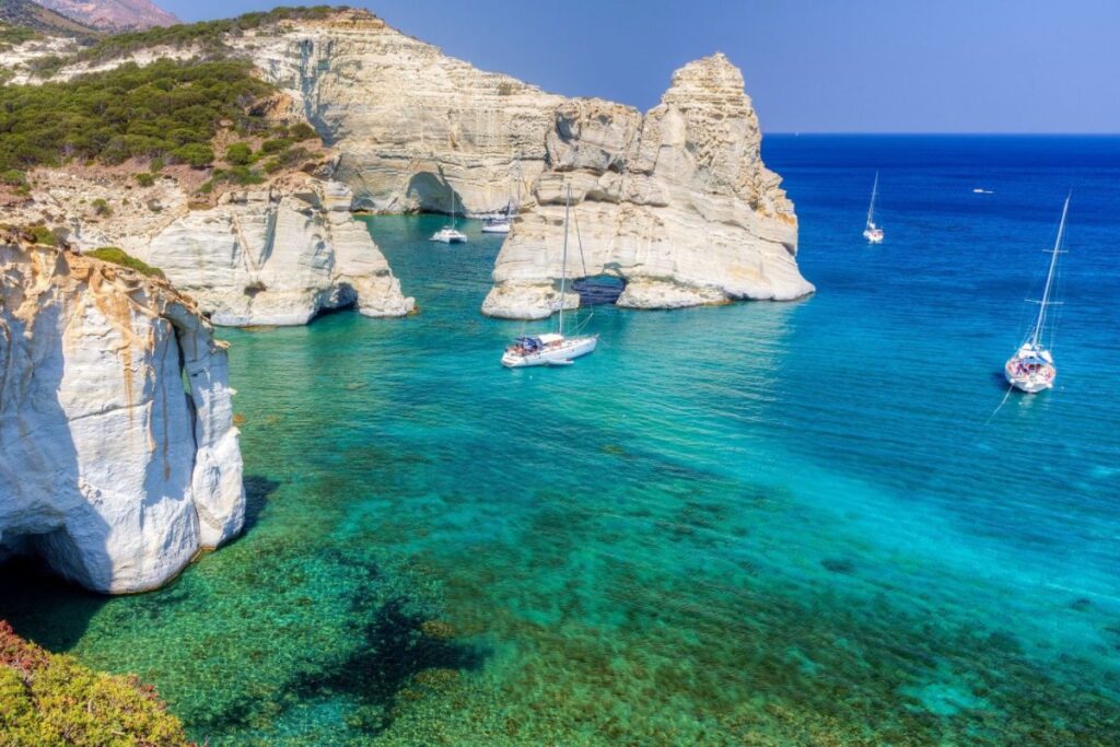 Kleftiko beach with yachts  in Milos Island.