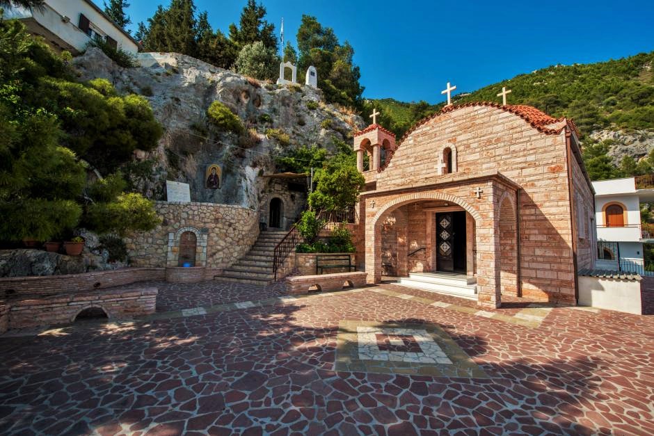 Things to Do in Loutraki Greece. External view of the yard and the main church of Agios Potapios Monastery