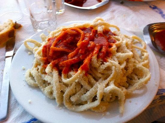 A dish with Folegandros local matsata, pasta with red sauce
