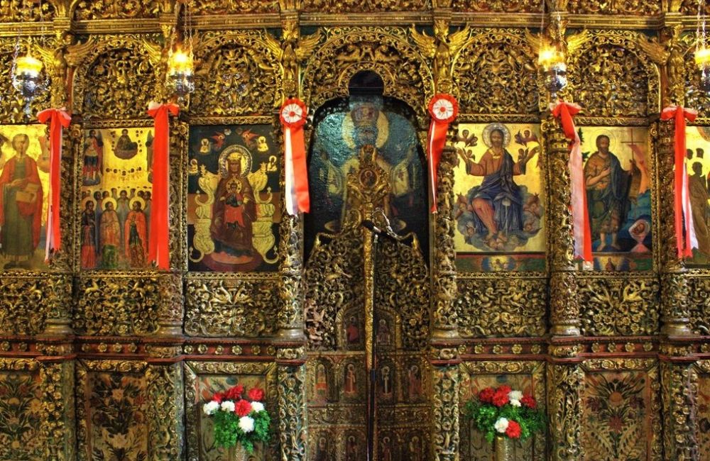 Black orthodox Saints pammegiston taxiarxon iconostasis.