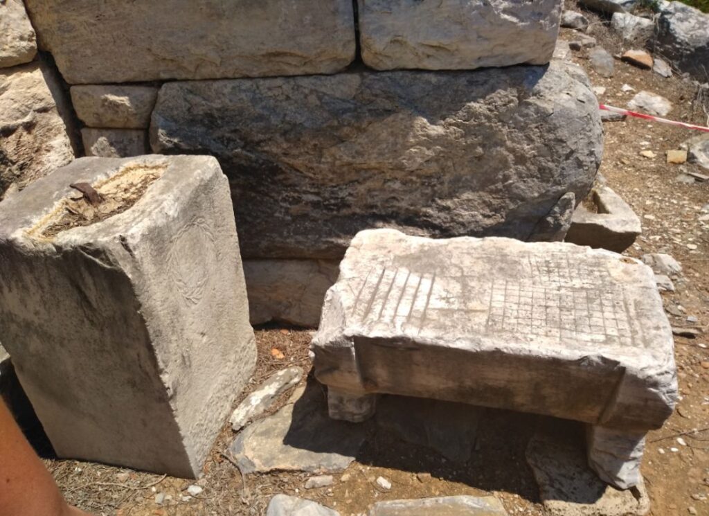 Marble desk used for basic arithmetic in Ramnous Archaeological Site in Athens.