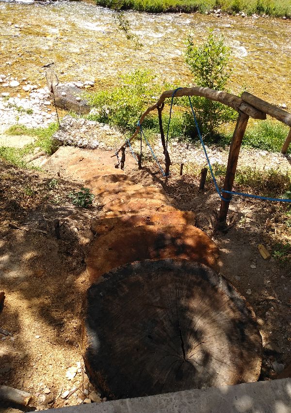 Wooden stairs in Nemouta Water falls in Ancient Olympia Greece.