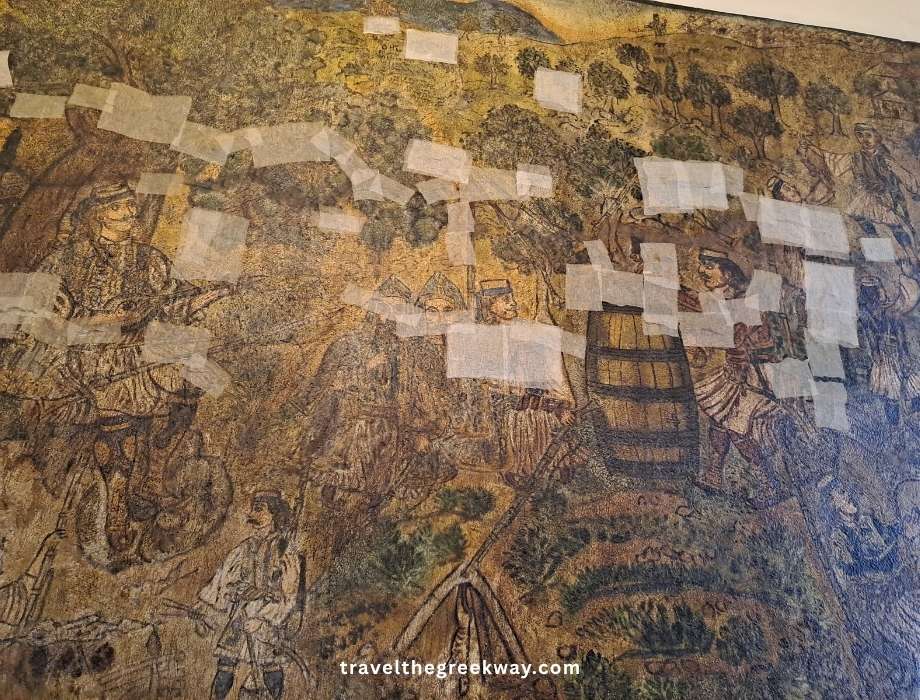 Theofilos painted mural inside a traditional Makrinitsa café under restoration.