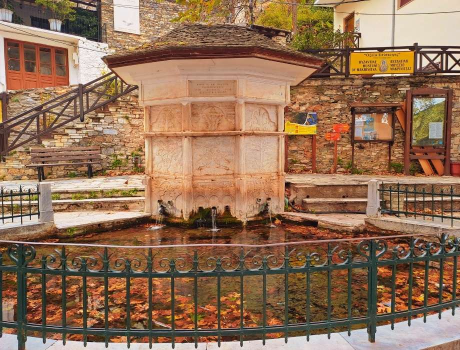 The carved marble Immortal Water Fountain in Makrinitsa Pelion.