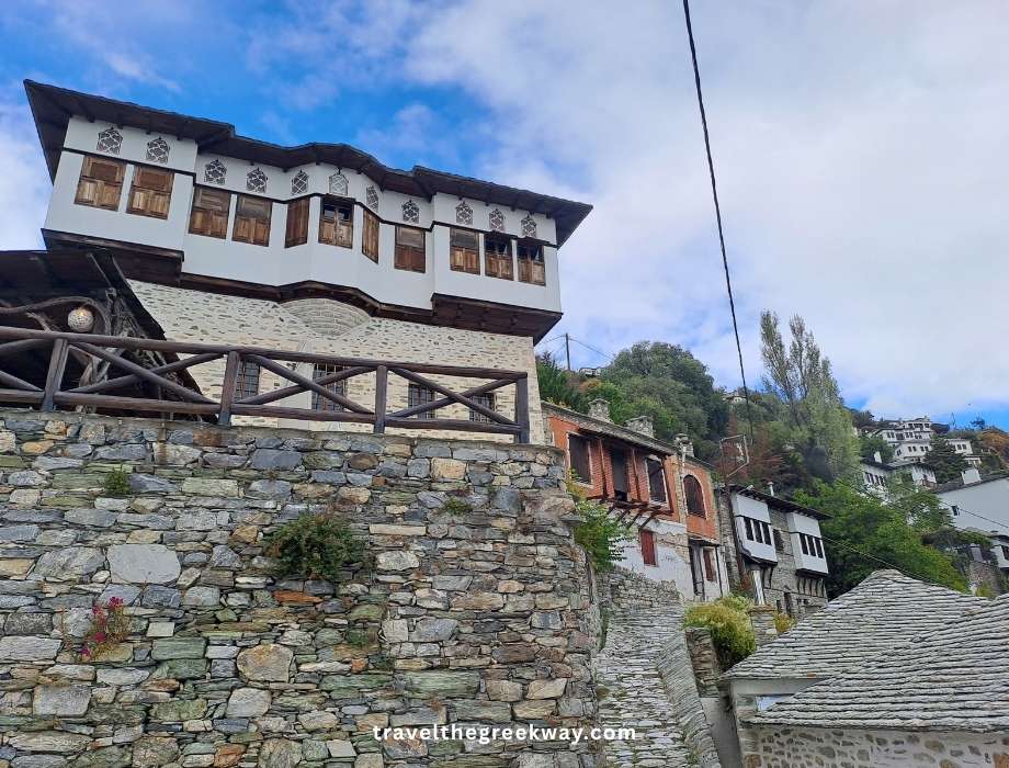Traditional stone mansion in Makrinitsa with wooden balcony and Ottoman-era design.