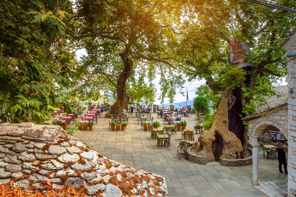Central Square of Makrinitsa Pelion with tables and chairs under the trees