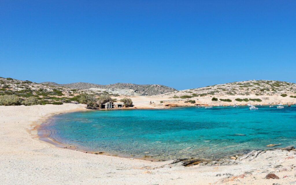 Crystal-clear waters and sandy coast at Kalotaritissa Beach—one of the best beaches in Amorgos and a highlight of any Amorgos travel guide.
