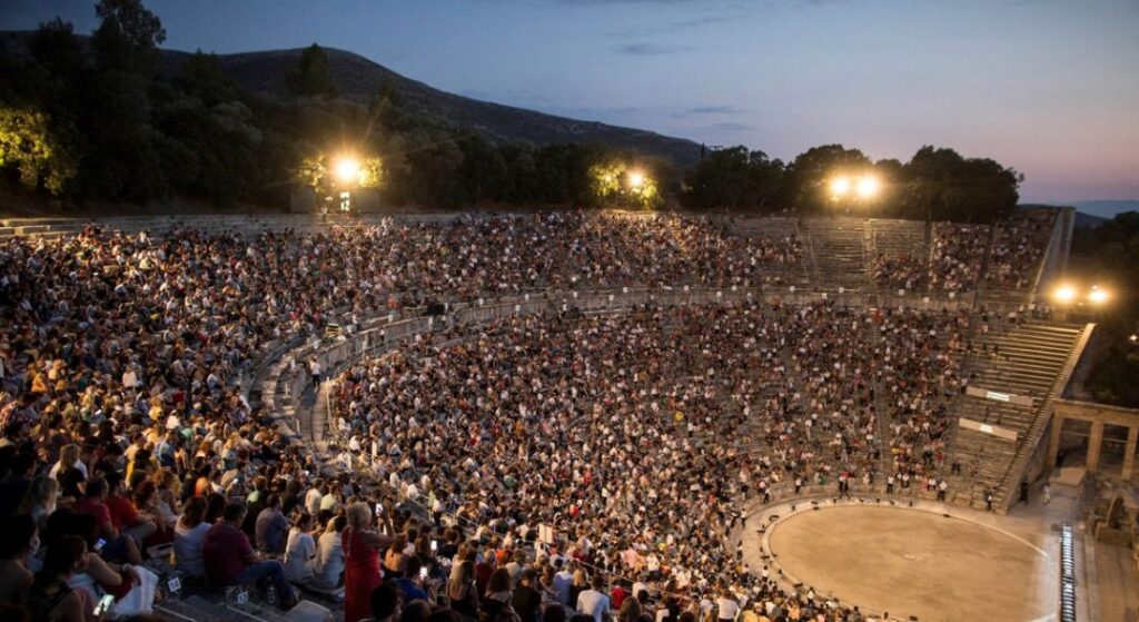 Performance in Ancient Theater of Epidaurus and hundreds of people at dome in Theater of Epidaurus Peloponnese.  