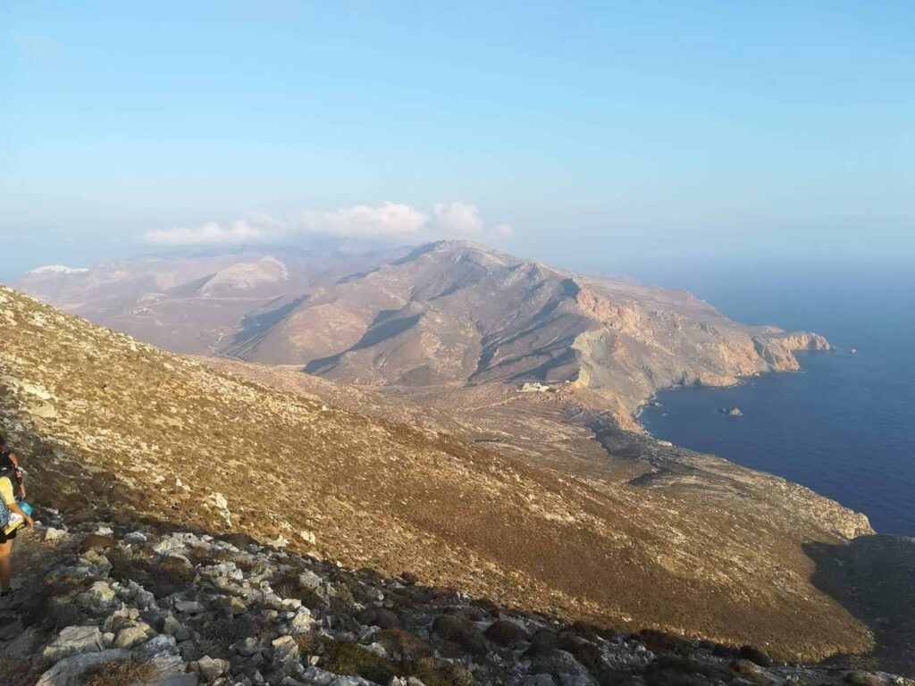 A rocky terrain, volcanic-ash granite, and limestone from the Santorini volcanic eruption paths, steep cliffs, and cove-scalloped morphology in Anafi