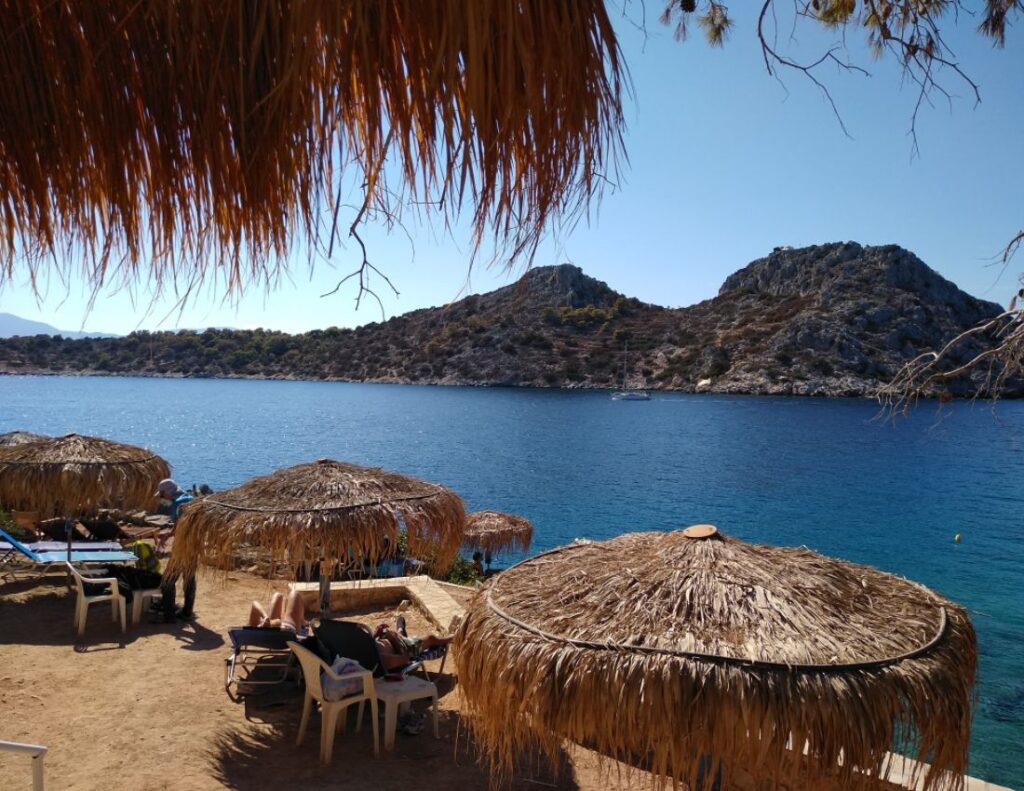 The other side of the Aponissos beach with umbrellas 