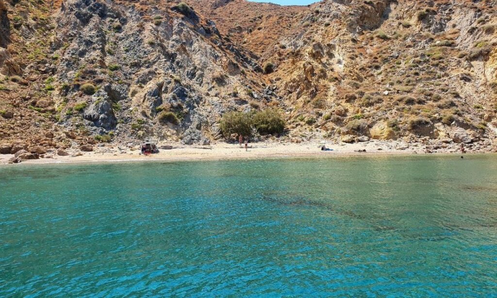 The Livoskopos Beach with some tree and two people