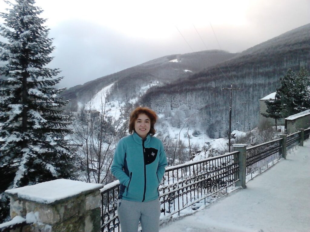 Greece in Winter, Evgenia standing at Pisoderi Ski resort