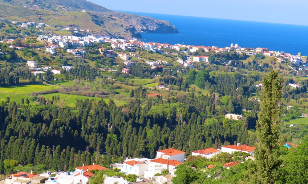 A beautiful view from Andros Island with some houses and trees, Greece in October.