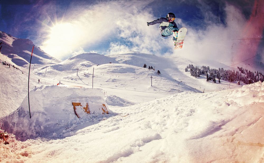 Kalavrita resort with snow and a skier. Ski resort In Greece.