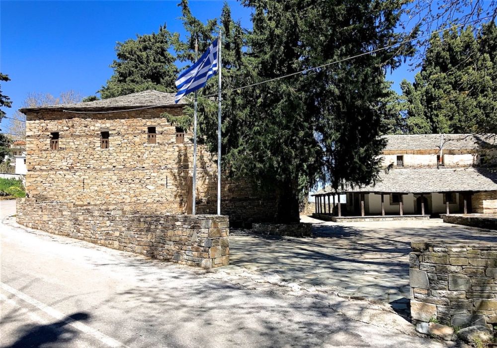  Ellinomouseio in Zagora and the Greek Flag. Zagora Greece.