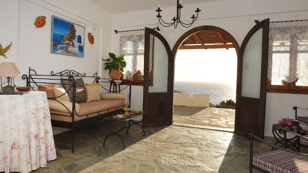 Best things to do in Syros Greece, Anemos and Almyra hotel. A traditional room with view to the sea. In Syros Island Greece.