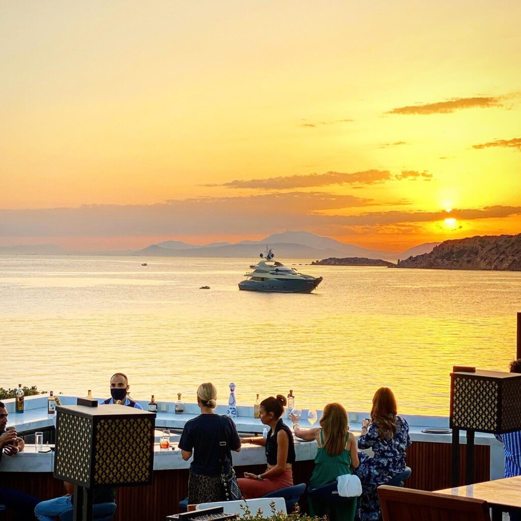 Athens Riviera Bar with women drinking and watching the sunset