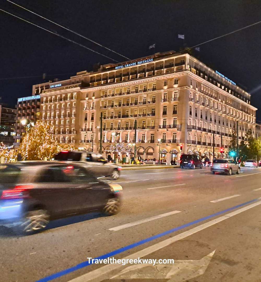 The litt exterior of the Hotel Grande Bretagne during Christmas.