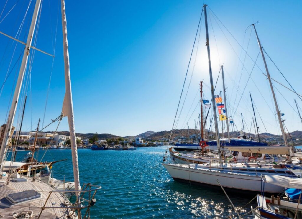 Best things to do in Syros Greece, Finikas seaside village in the south of Syros with yachts in Syros Island Grece.
