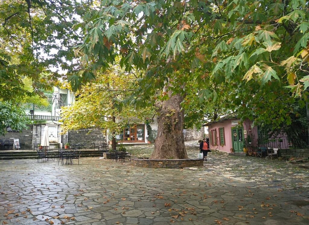 Zagora's Main Square in Pelion Peninsula and a woman walking. Zagora Greece.