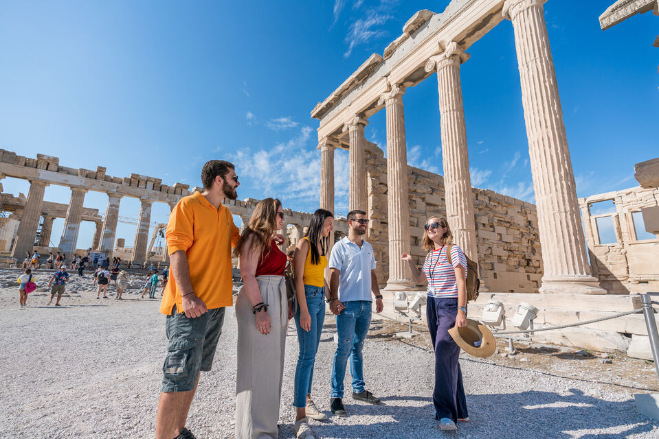 Small Group tour of Acropolis, 2 couples with a guide in front of Erechteion