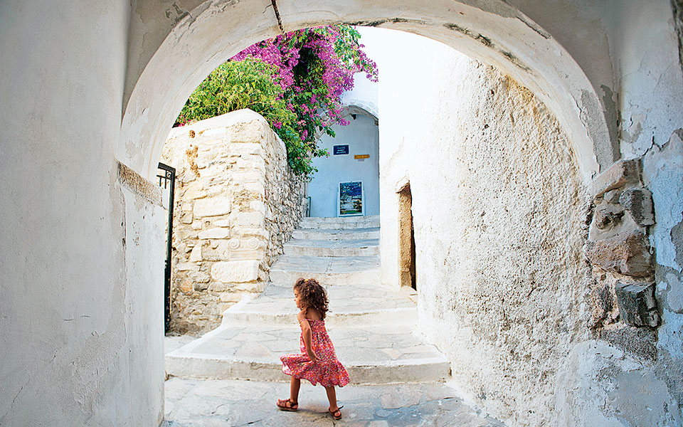 Greek Island hiking, A small girl walking in Kastro in Naxos island