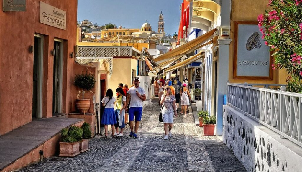 People walking a shopping street in Fira Santorini