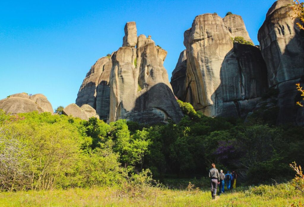 Hike Safely in Greece, a group of hikers in Meteora rocks