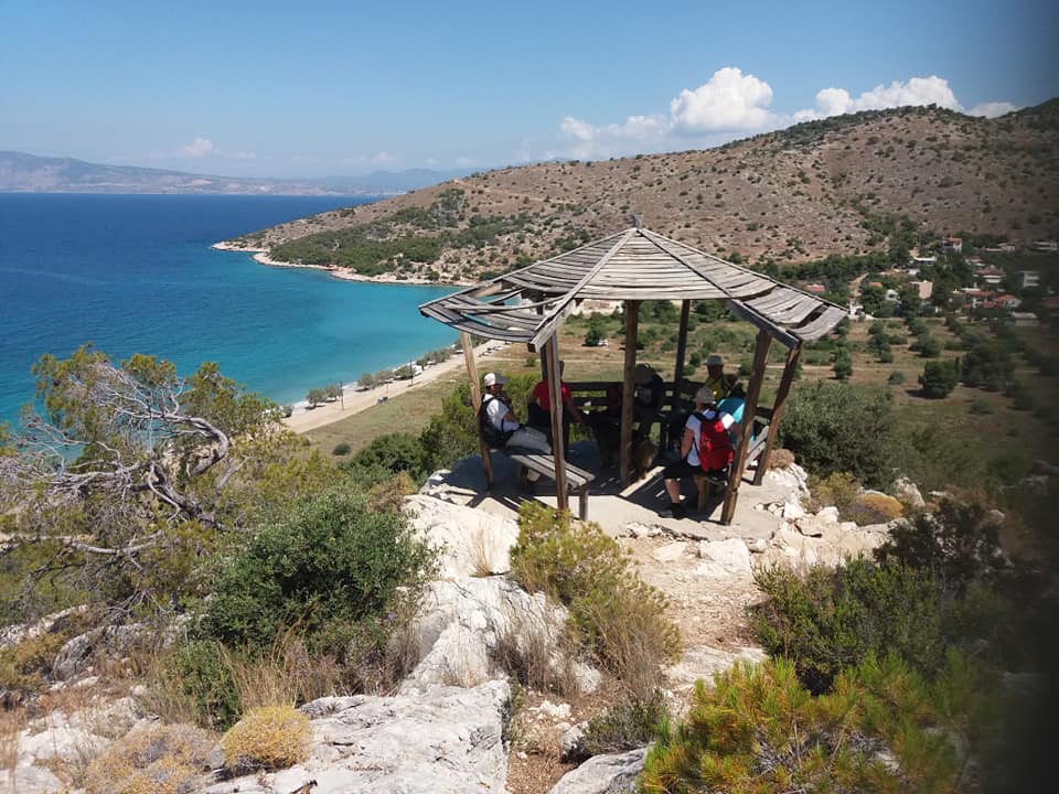 Hikers resting in a kiosk over Salamina Kanakia beach