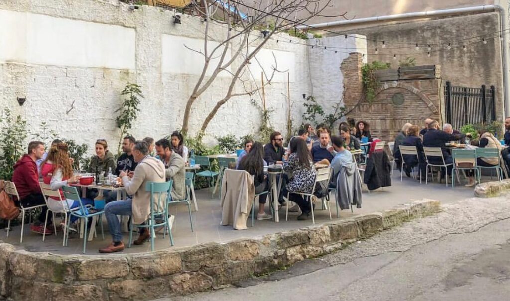 Best Seafood restaurants in Athens,  Aiolou 68 tavern yard with some people sitting in Athens Greece.