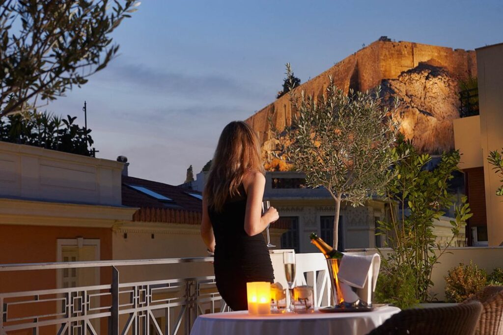 Greece Packing list, a woman looking at Acropolis walls