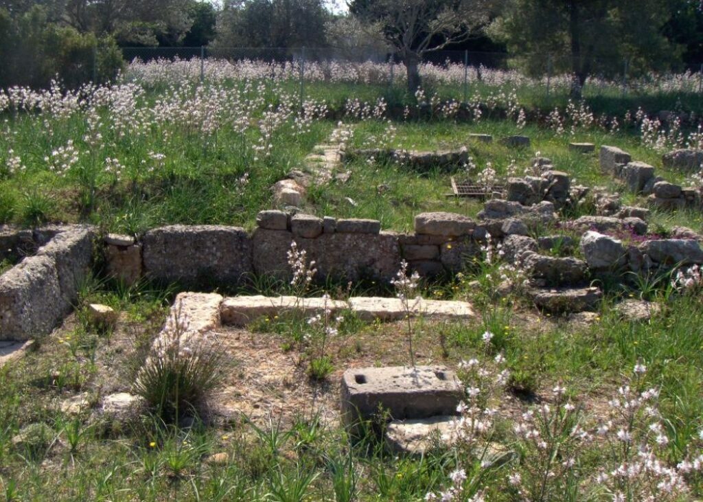 Ancient Porto Heli and some trees and grass in Peloponnese Greece.