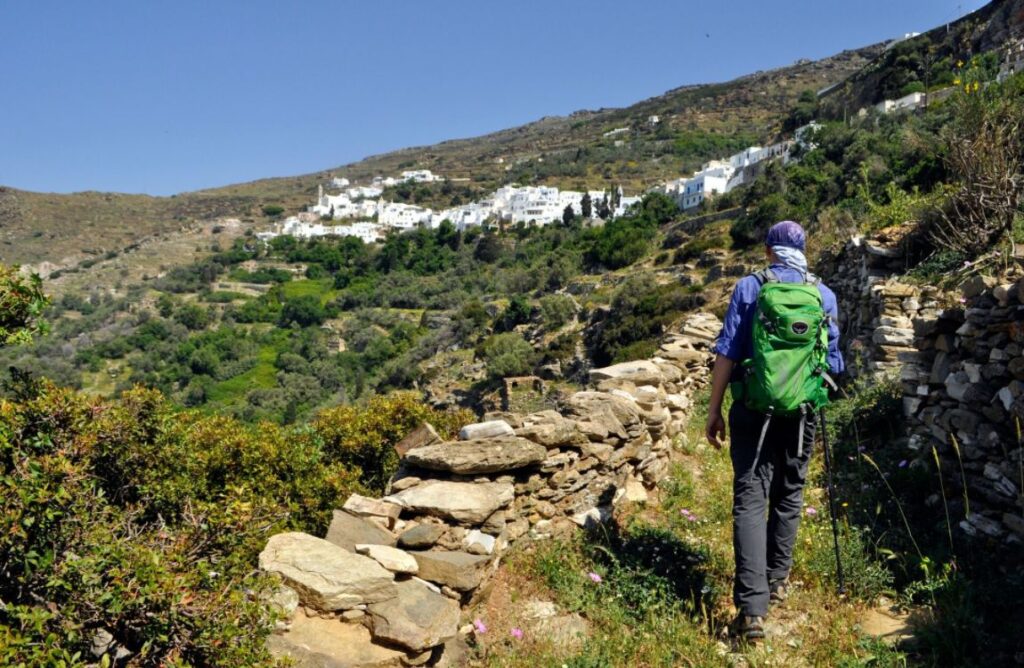 Hiking Cyclades Islands, A hiker on Tinos island trails in Greece.  Hiking Cyclades islands.