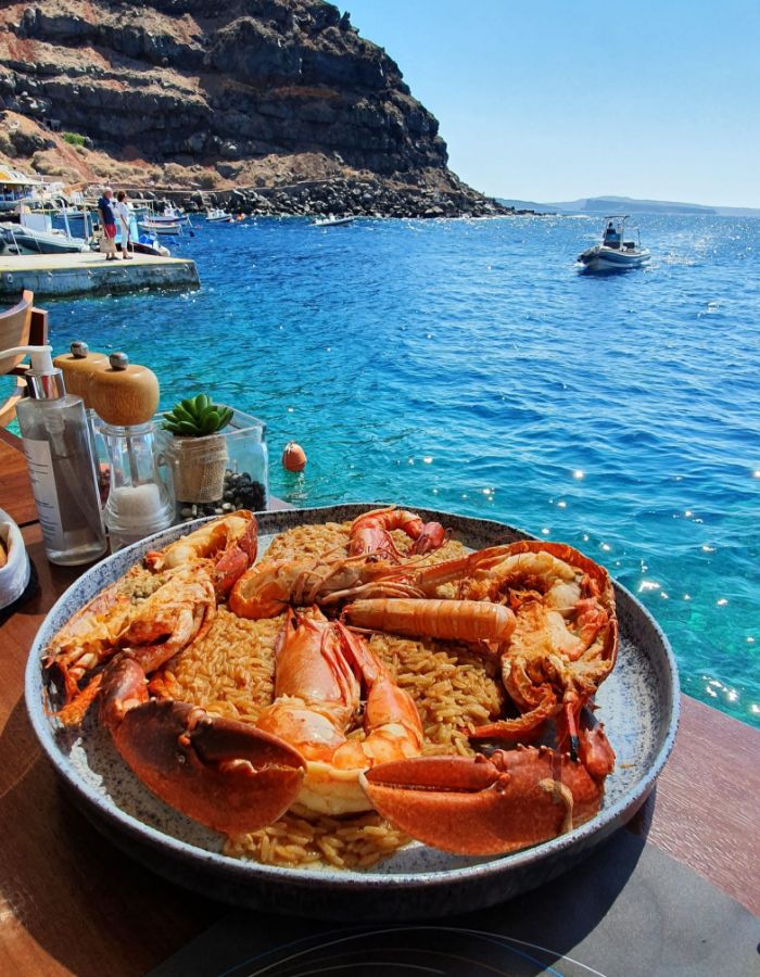 An impressive large dish full with lobster and crayfish in a seafront restaurant. 