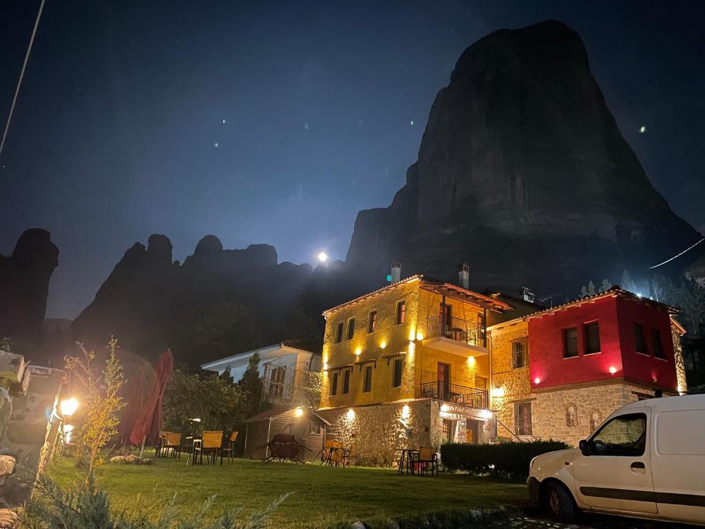 Archontiko hotel at night with stars on the sky.