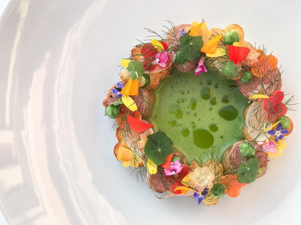 Selene's Spring diner in Santorini luxurious dish decorated like a spring wreath. 