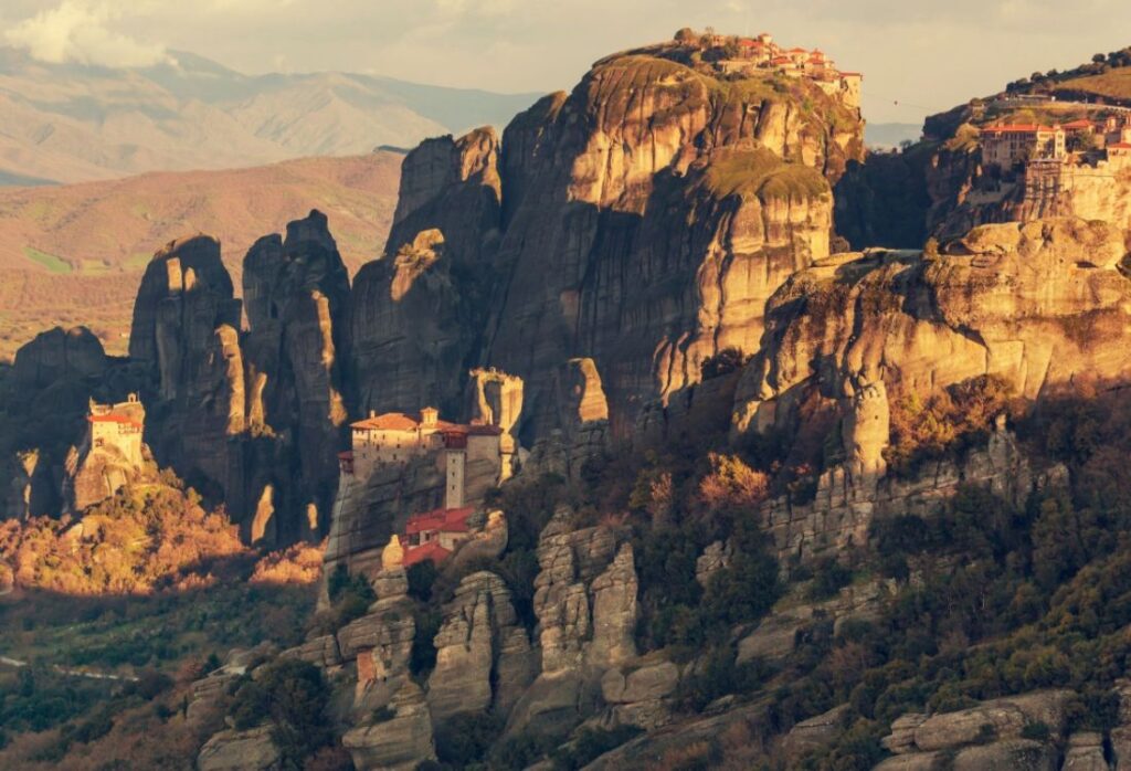 General view of 5 out of 6 of the Meteora Monasteries taken from a drone.