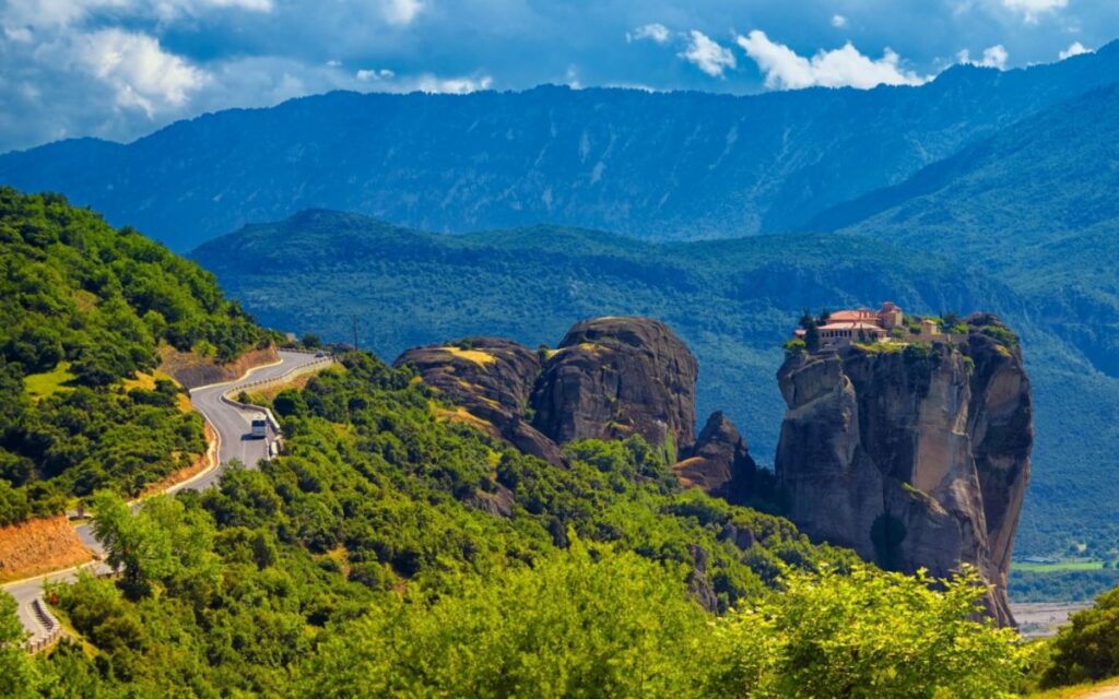 A beautiful view from Roussanou Meteora Monasteries in a sunny day taken from a drone.
