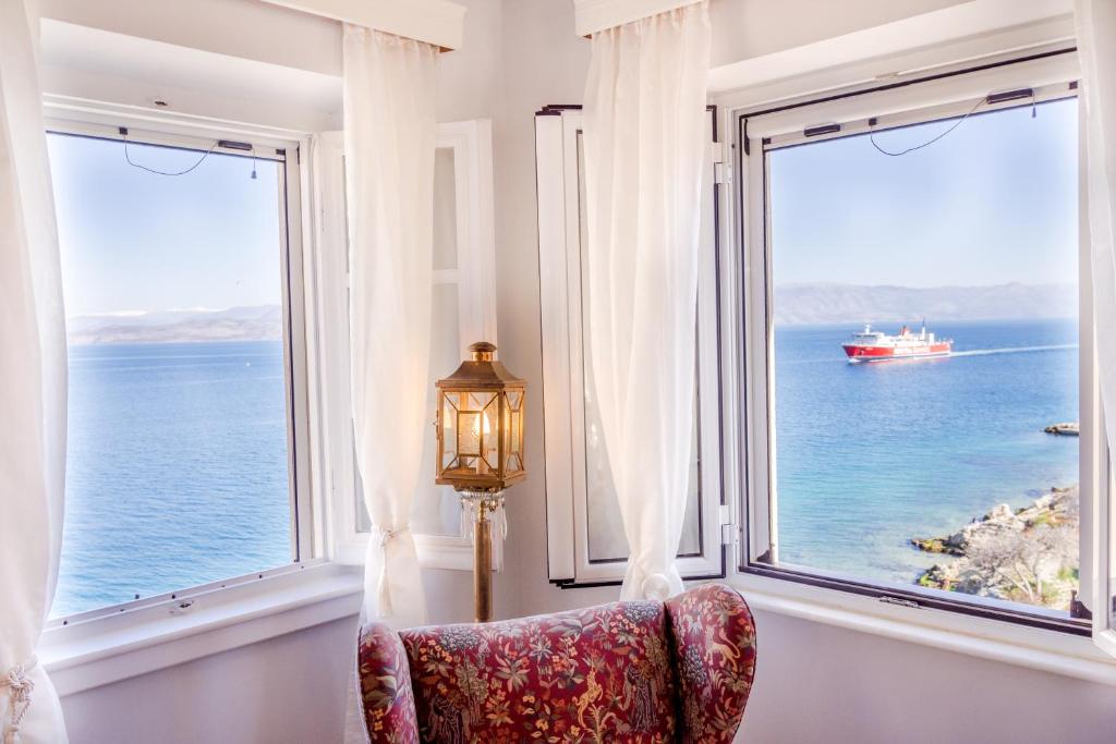 View throw two windows to the sea from Lighthouse apartment. Best things to do on Corfu island.