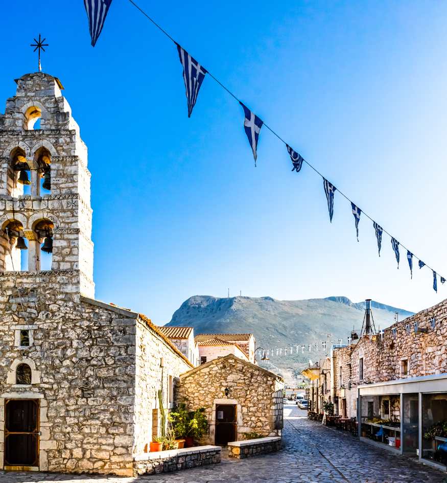 Traditional stone-built towers and paved streets of Areopoli in the Mani region, Peloponnese, Greece in April.