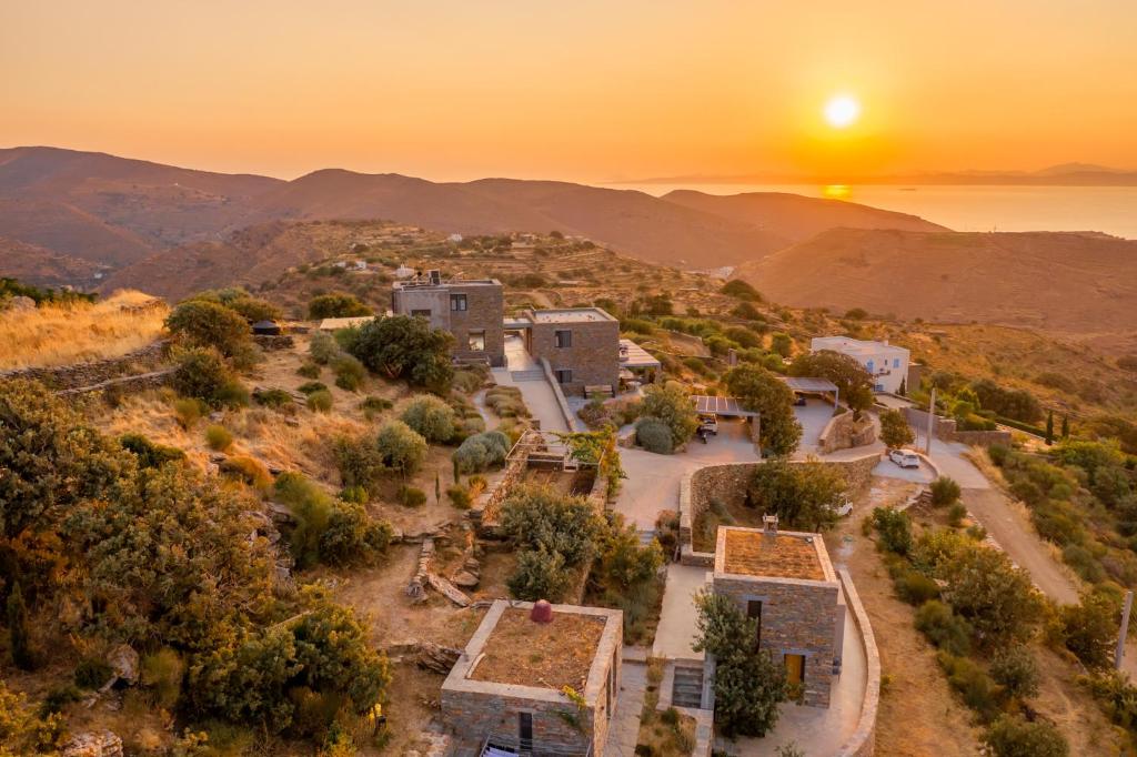 A hotel called Agrikea on the cliff with a beautiful sunset in Kea Island.