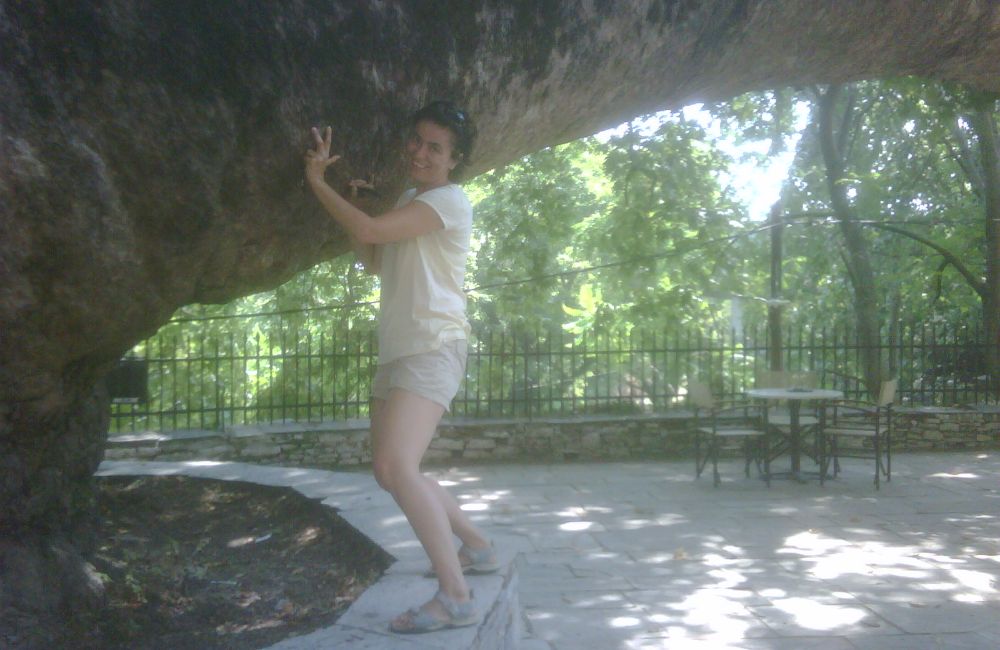 Evgenia at the gigantic plane tree in Tsagarada Pelion Greece. 